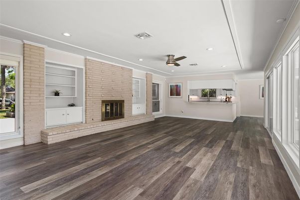 Empty room, Fireplace, Interior, Recessed Lighting, Stone Walls, Wood Texture Flooring