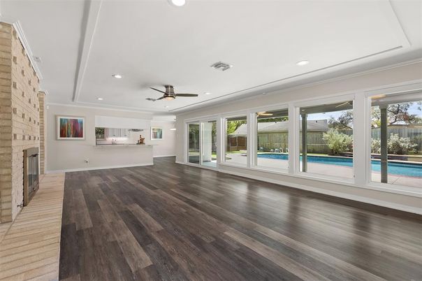 Empty room, Fireplace, Interior, Recessed Lighting, Stone Walls, Wood Texture Flooring