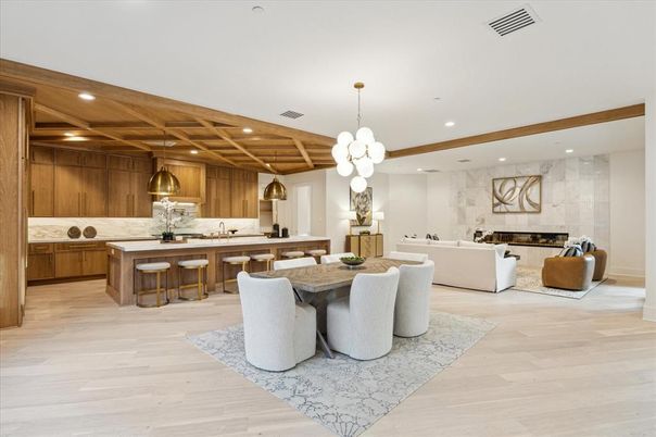 Chandelier, Dining room, Fireplace, Interior, Kitchen, Living room, Marble Walls, Pendant Lights, Recessed Lighting, Wooden Ceilings, Wood Texture Flooring