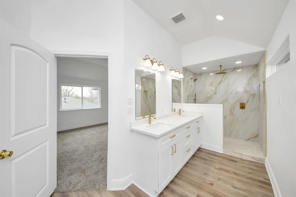 Bathroom, Dual Sink Vanities, Interior, Marble Walls, Recessed Lighting, Wood Texture Flooring