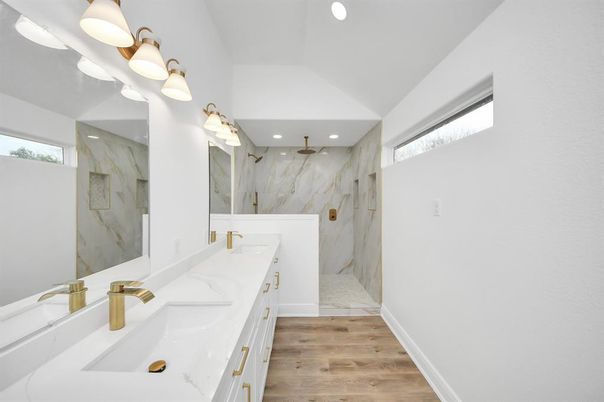 Bathroom, Dual Sink Vanities, Interior, Marble Walls, Recessed Lighting, Wood Texture Flooring