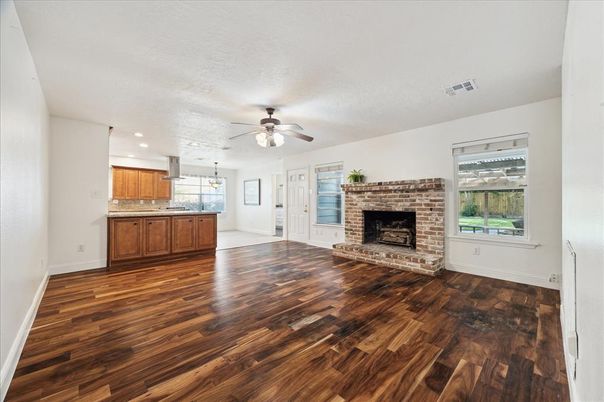 Empty room, Fireplace, Interior, Kitchen, Recessed Lighting, Wood Texture Flooring