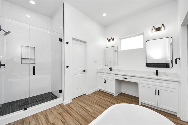 Bathroom, Dual Sink Vanities, Free Standing Baths, Glass Shower, Interior, Recessed Lighting, Wood Texture Flooring