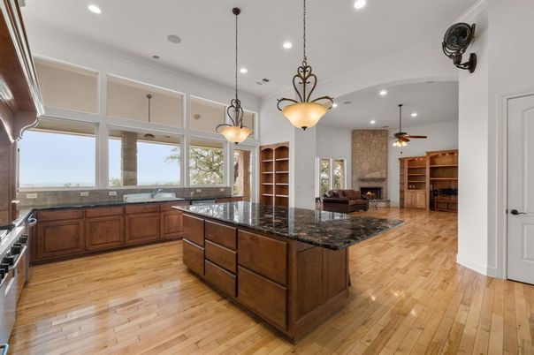 Fireplace, Interior, Kitchen, Pendant Lights, Recessed Lighting, Stone Walls, Wood Texture Flooring