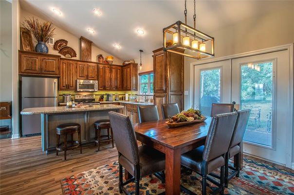 Dining room, Interior, Kitchen, Pendant Lights, Recessed Lighting, Stainless Steel Appliances, Wood Texture Flooring