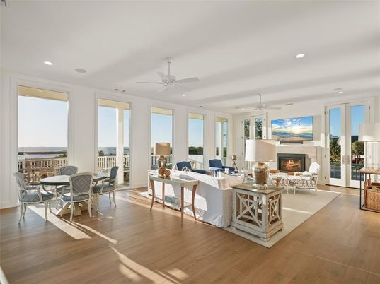 Dining room, Fireplace, Interior, Living room, Recessed Lighting, Water, Wood Texture Flooring