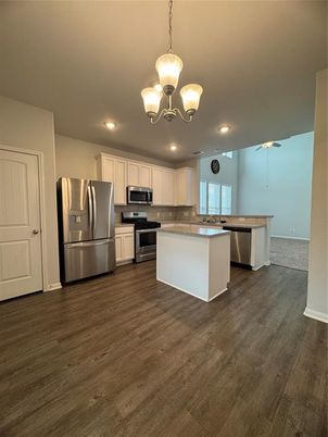 Chandelier, Interior, Kitchen, Pendant Lights, Recessed Lighting, Stainless Steel Appliances, Wood Texture Flooring
