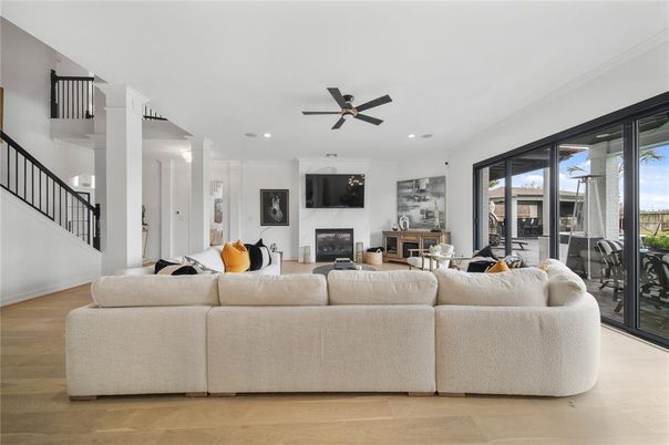 Dining room, Fireplace, Interior, Living room, Recessed Lighting, Wood Texture Flooring