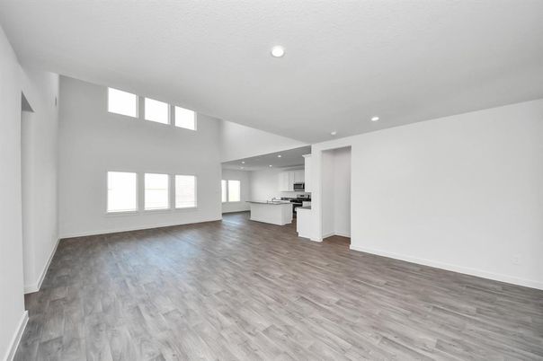 Empty room, Interior, Kitchen, Recessed Lighting, Stainless Steel Appliances, Wood Texture Flooring