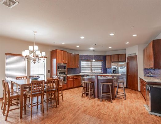 Chandelier, Dining room, Interior, Kitchen, Recessed Lighting, Stainless Steel Appliances, Wood Texture Flooring
