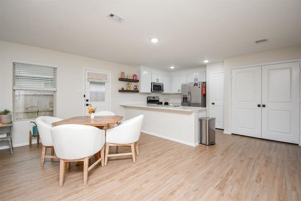 Dining room, Interior, Kitchen, Recessed Lighting, Stainless Steel Appliances, Wood Texture Flooring