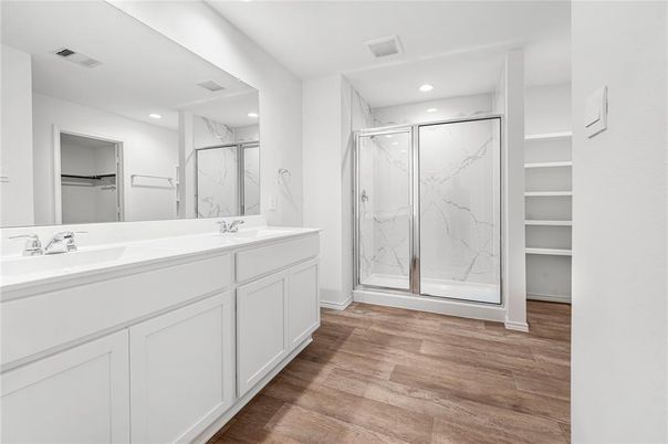Bathroom, Dual Sink Vanities, Glass Shower, Interior, Marble Walls, Recessed Lighting, Wood Texture Flooring