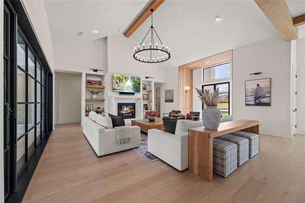 Chandelier, Dining room, Fireplace, Interior, Living room, Pendant Lights, Recessed Lighting, Wooden Beams, Wood Texture Flooring
