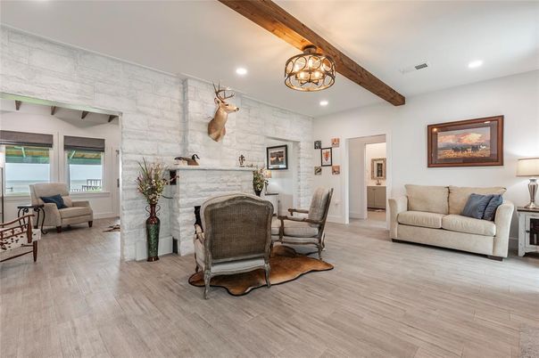 Chandelier, Fireplace, Interior, Living room, Recessed Lighting, Stone Walls, Wooden Beams, Wood Texture Flooring