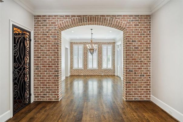 Chandelier, Empty room, Interior, Recessed Lighting, Stone Walls, Wood Texture Flooring