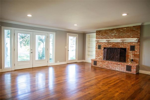 Empty room, Fireplace, Interior, Recessed Lighting, Stone Walls, Wood Texture Flooring