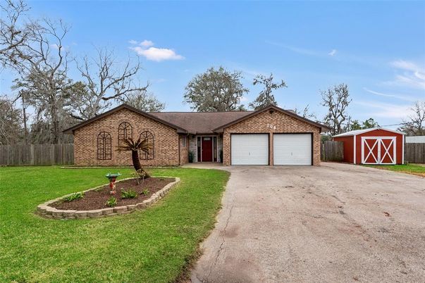 Attached, Backyard, Exterior, Facade, Brick Facade, Ranch