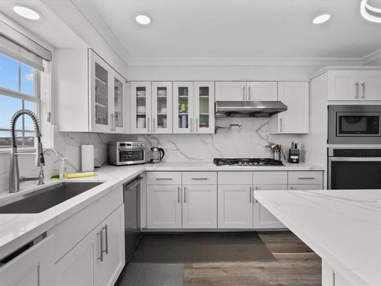 Interior, Kitchen, Marble Walls, Recessed Lighting, Stainless Steel Appliances, Wood Texture Flooring
