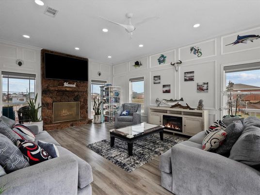 Fireplace, Interior, Living room, Recessed Lighting, Stone Walls, Wood Texture Flooring