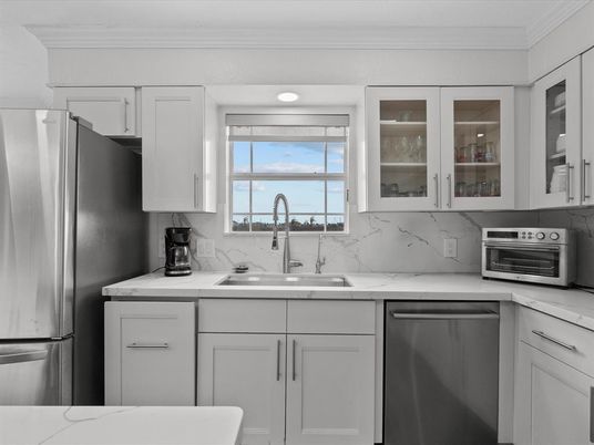 Interior, Kitchen, Marble Walls, Recessed Lighting, Stainless Steel Appliances