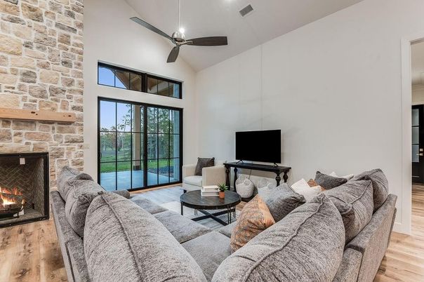 Fireplace, Interior, Living room, Recessed Lighting, Stone Walls, Wood Texture Flooring