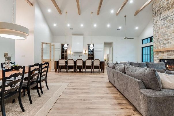 Dining room, Fireplace, Interior, Living room, Pendant Lights, Recessed Lighting, Stone Walls, Wooden Beams, Wood Texture Flooring
