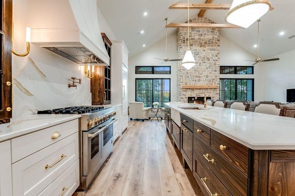 Fireplace, Interior, Kitchen, Living room, Pendant Lights, Recessed Lighting, Stainless Steel Appliances, Stone Walls, Wooden Beams, Wood Texture Flooring