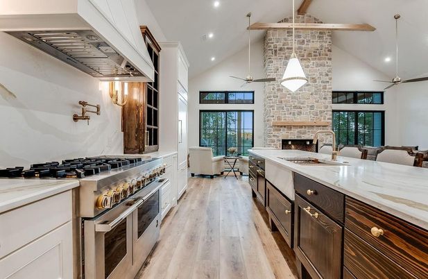 Fireplace, Interior, Kitchen, Living room, Pendant Lights, Recessed Lighting, Stainless Steel Appliances, Stone Walls, Wooden Beams, Wood Texture Flooring
