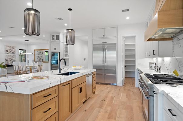Dining room, Interior, Kitchen, Pendant Lights, Recessed Lighting, Stainless Steel Appliances, Wood Texture Flooring