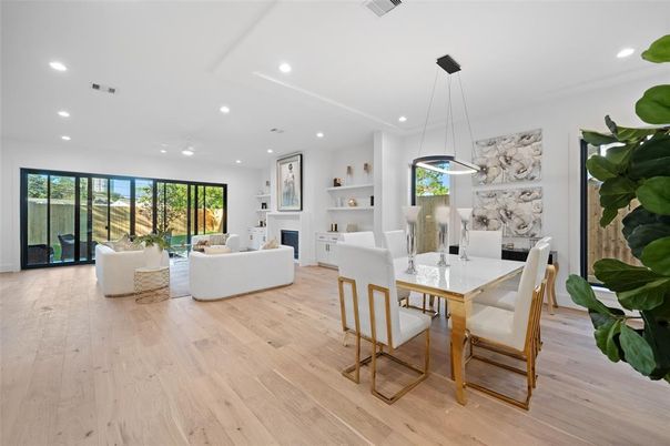 Dining room, Fireplace, Interior, Living room, Pendant Lights, Recessed Lighting, Wood Texture Flooring