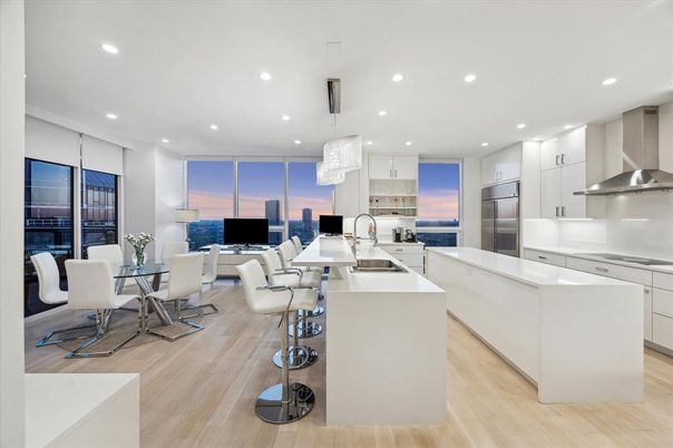 Chandelier, Dining room, Interior, Kitchen, Living room, Pendant Lights, Recessed Lighting, Stainless Steel Appliances, Wood Texture Flooring