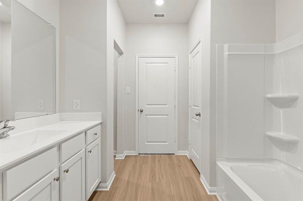 Bathroom, Dual Sink Vanities, Interior, Recessed Lighting, Wood Texture Flooring