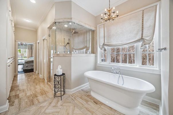 Bathroom, Chandelier, Free Standing Baths, Glass Shower, Interior, Recessed Lighting, Wood Texture Flooring