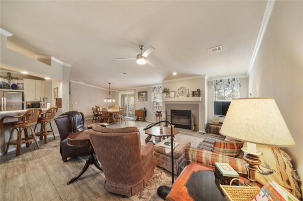 Dining room, Fireplace, Interior, Kitchen, Living room, Pendant Lights, Recessed Lighting, Stainless Steel Appliances, Wood Texture Flooring
