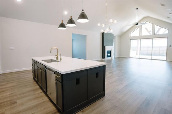 Empty room, Fireplace, Interior, Kitchen, Pendant Lights, Recessed Lighting, Wood Texture Flooring