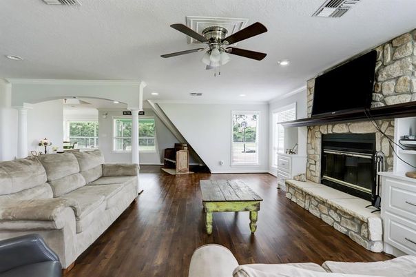 Fireplace, Interior, Living room, Recessed Lighting, Stone Walls, Wood Texture Flooring