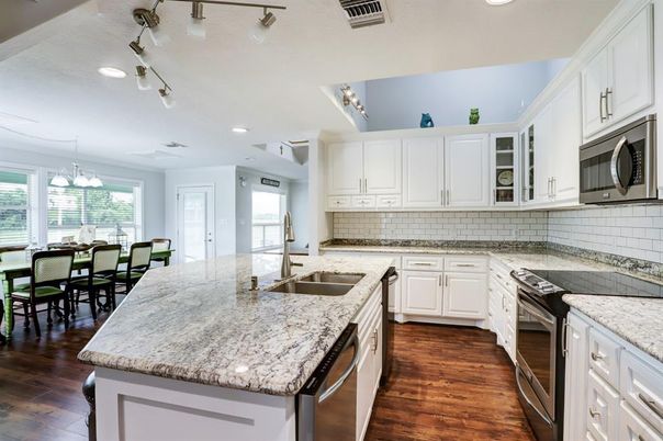 Chandelier, Dining room, Interior, Kitchen, Recessed Lighting, Stainless Steel Appliances, Wood Texture Flooring