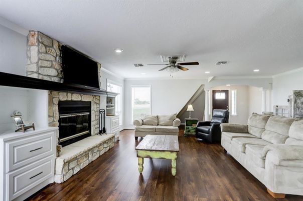 Fireplace, Interior, Living room, Recessed Lighting, Stone Walls, Wood Texture Flooring