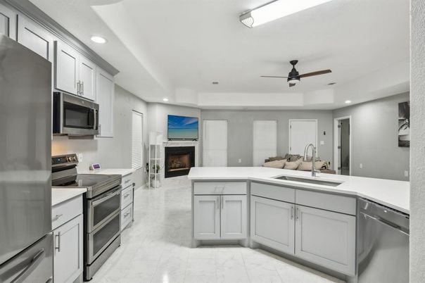 Fireplace, Interior, Kitchen, Marble, Recessed Lighting, Stainless Steel Appliances