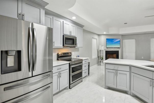 Fireplace, Interior, Kitchen, Marble, Recessed Lighting, Stainless Steel Appliances