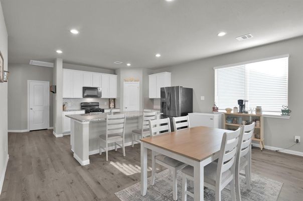Dining room, Interior, Kitchen, Recessed Lighting, Stainless Steel Appliances, Wood Texture Flooring