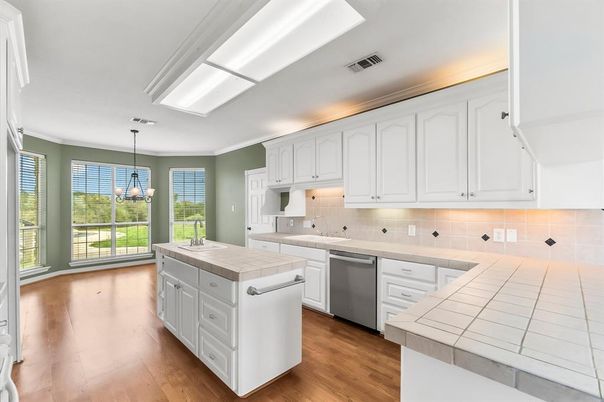 Interior, Kitchen, Pendant Lights, Tile Countertops, Wood Texture Flooring