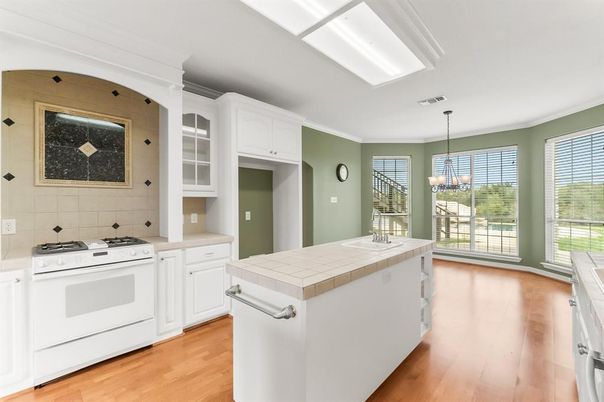 Chandelier, Interior, Kitchen, Pendant Lights, Tile Countertops, Wood Texture Flooring
