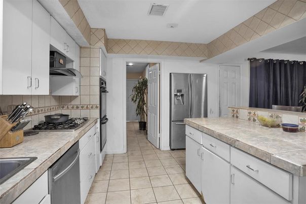 Interior, Kitchen, Recessed Lighting, Stainless Steel Appliances, Tile Countertops