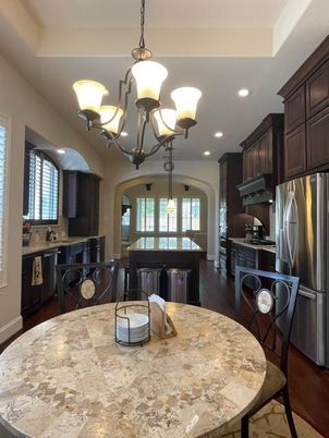Chandelier, Dining room, Interior, Kitchen, Pendant Lights, Recessed Lighting, Stainless Steel Appliances, Wood Texture Flooring