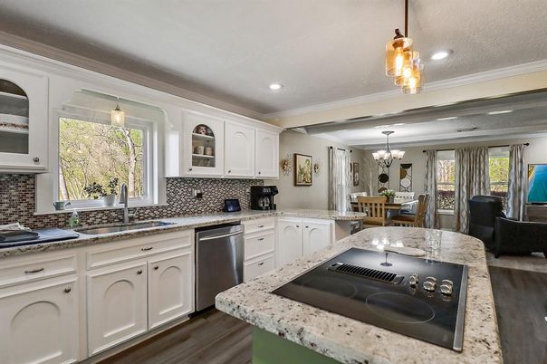 Chandelier, Dining room, Interior, Kitchen, Pendant Lights, Recessed Lighting, Stainless Steel Appliances, Wood Texture Flooring