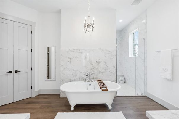 Bathroom, Free Standing Baths, Interior, Marble Walls, Pendant Lights, Recessed Lighting, Wood Texture Flooring