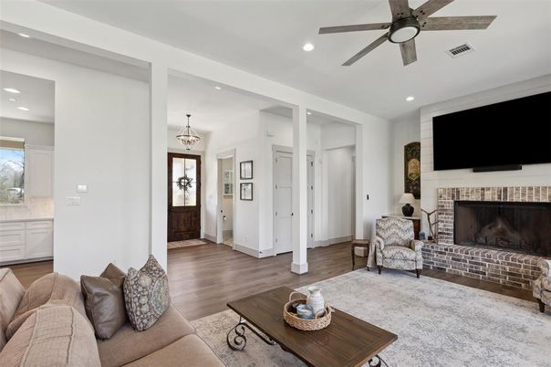 Chandelier, Fireplace, Interior, Living room, Recessed Lighting, Wood Texture Flooring