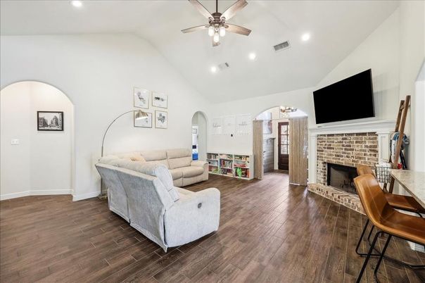 Chandelier, Fireplace, Interior, Kitchen, Living room, Recessed Lighting, Wood Texture Flooring