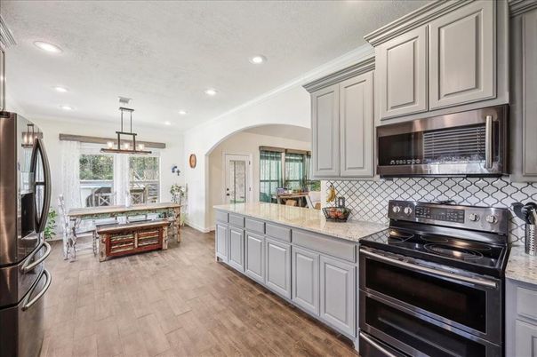 Dining room, Interior, Kitchen, Pendant Lights, Recessed Lighting, Stainless Steel Appliances, Wood Texture Flooring